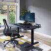 Electric Standing Desk 48x30 Black in raised position at home