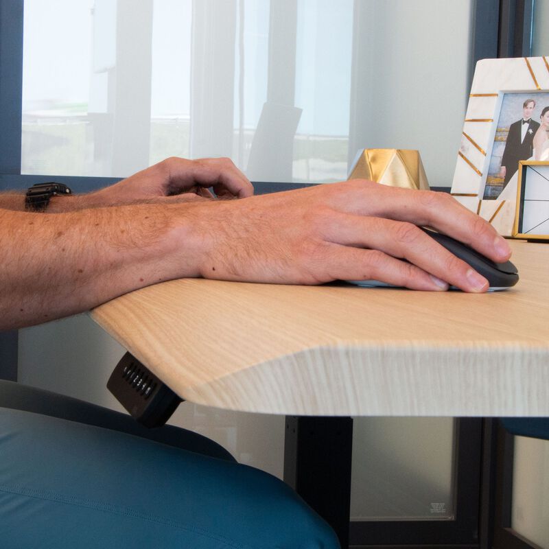 wrist resting comfortably on the slope of desk image number null