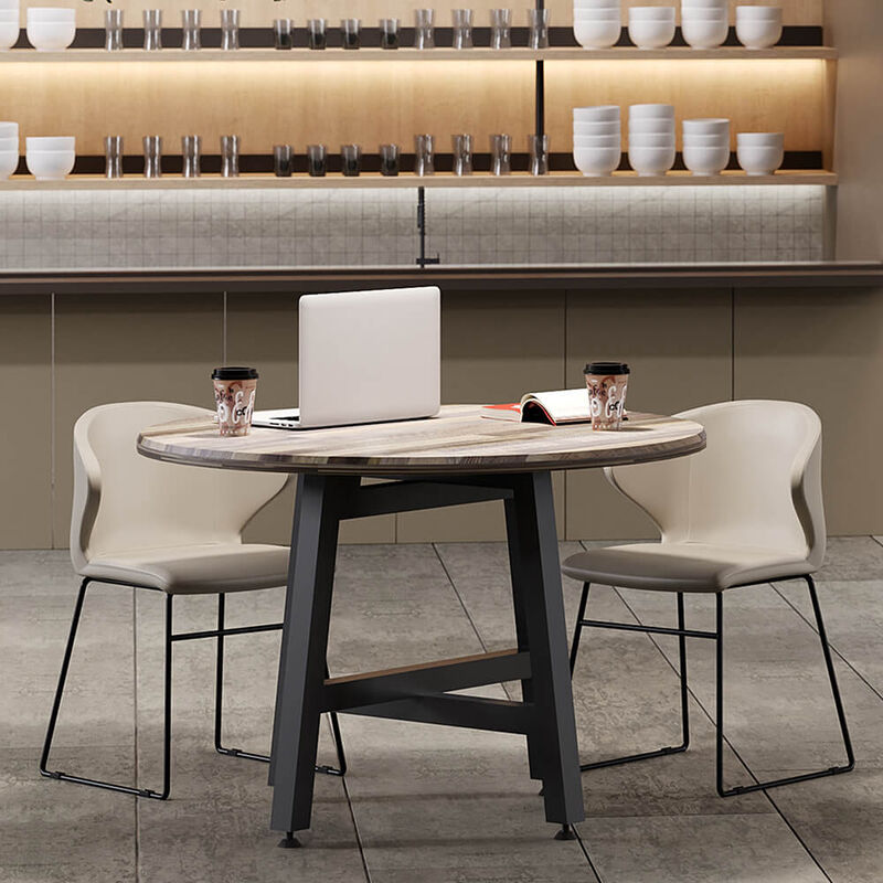 sand grey cafe chairs around round table in lounge setting image number null