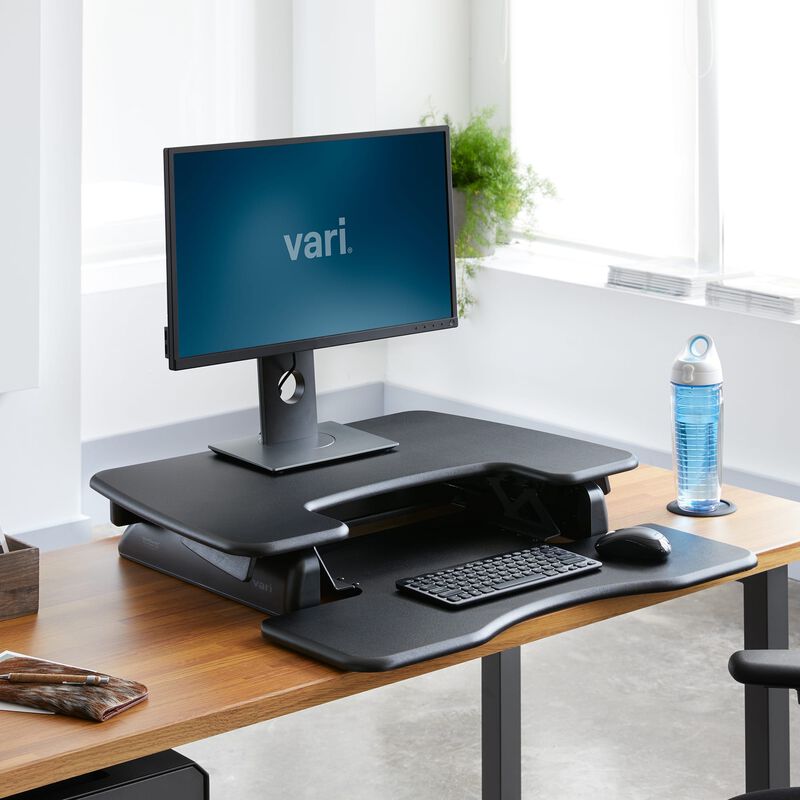 VariDesk Pro Plus 30 Black sit-stand desk converter lowered in office  image number null