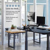 electric standing desk in an office setting with a customer review rating saying love my desk delivered when vari said it would be delivered easy to setup works flawlessly and looks great by joseph 