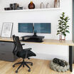 varidesk electric dual monitor converter in black in a lowered position on desk 