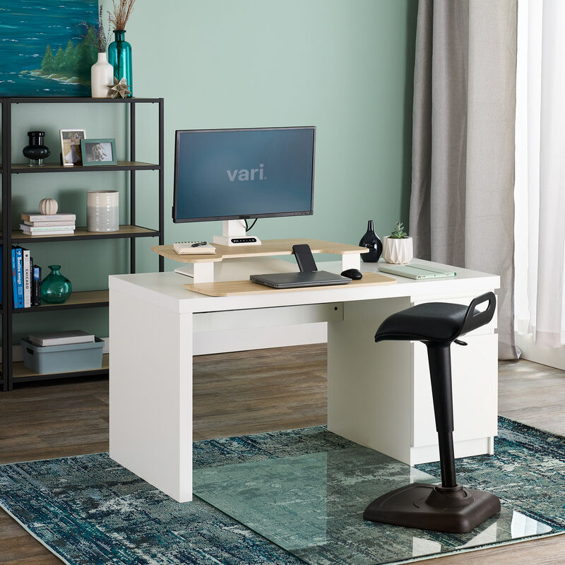 varidesk electric single monitor converter in light wood in a lowered position on desk  image number null