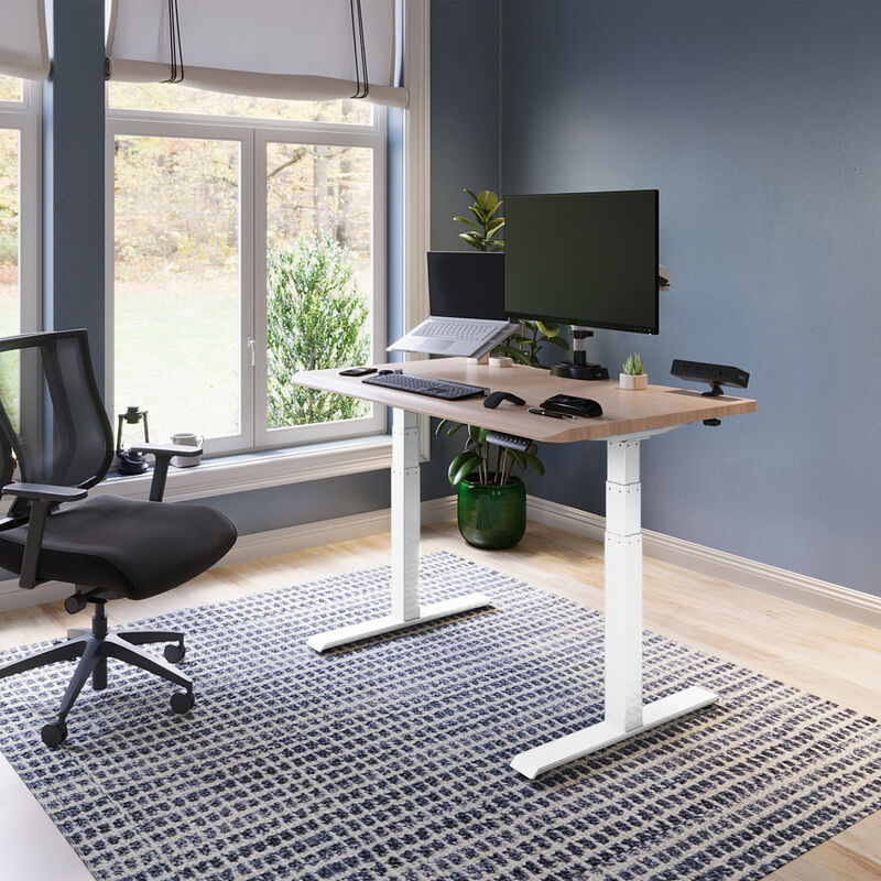 electric standing desk with comfortedge in 48x30 light wood top and white legs in raised position at home image number null