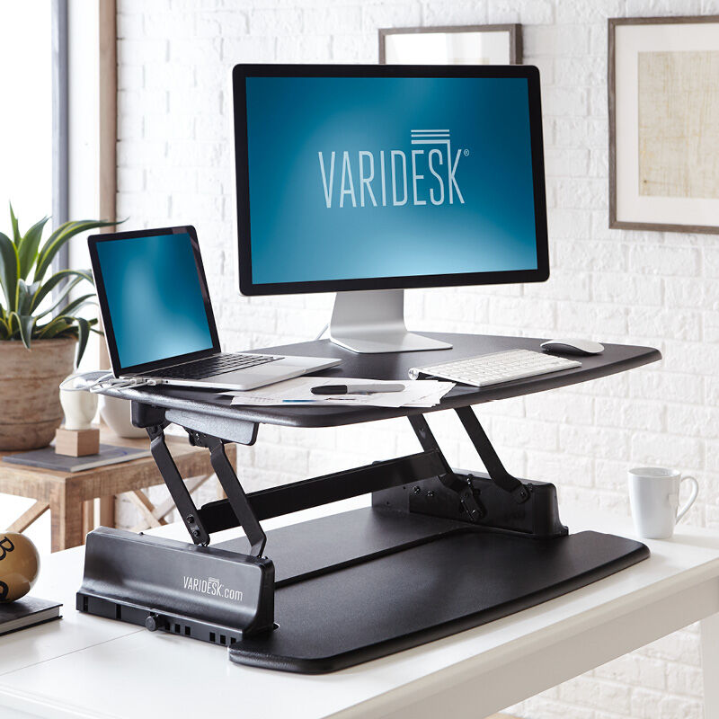 VariDesk Pro 36 Black sit-stand desk converter in raised position in office  image number null