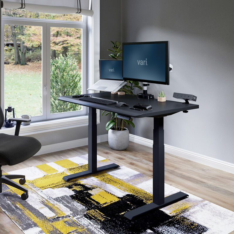Electric Standing Desk 48x30 Black in lowered position at home image number null