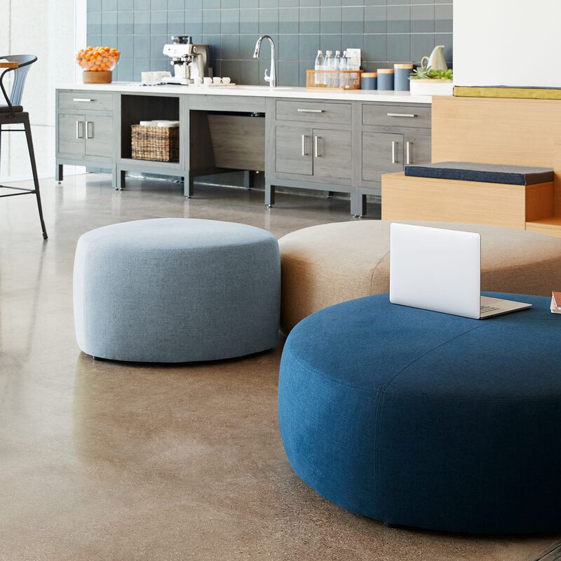 small light blue ottoman in lounge setting image number null