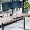 curved edge desk highlighting all the accessories that will fit on the desk