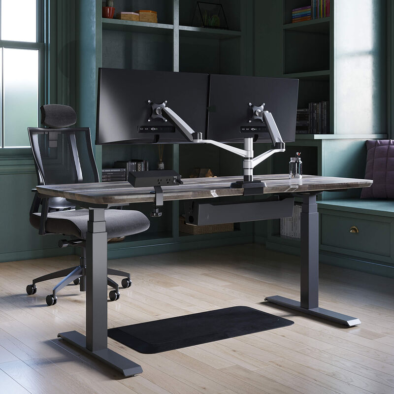 Sit stand executive workspace bundle comprised of electric standing desk 72 by 30, standing mat 36 by 24, dual monitor arm, power hub, cable tray and task chair with headrest.  image number null