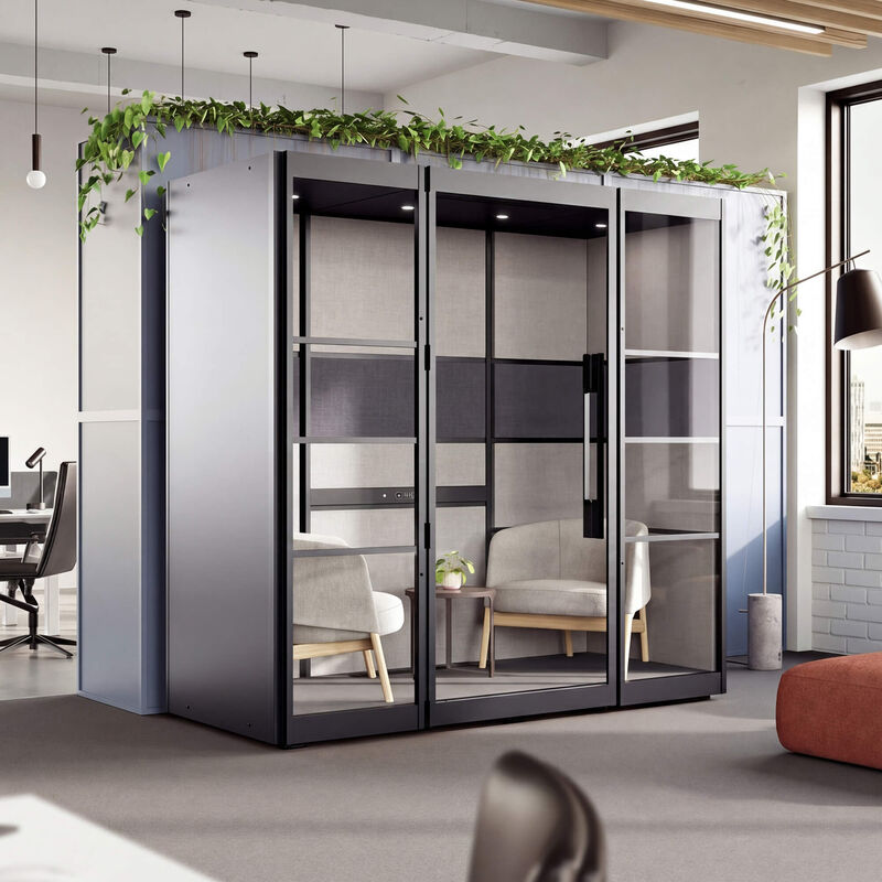 two person privacy booth in the black finish against a wall in an office with furniture inside of it angled view image number null