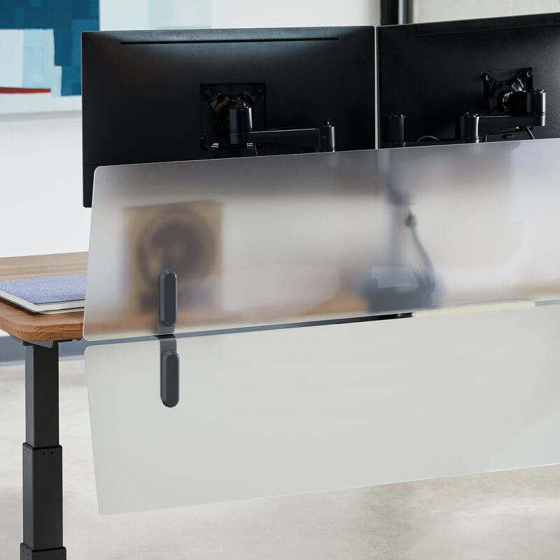 Acrylic Modesty Panel 60 installed on a Electric Standing Desk 60 in Frosted Acrylic in an office setting image number null