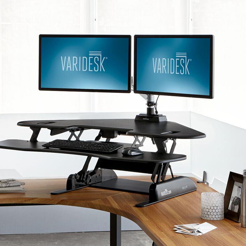 VariDesk Cube Corner 48 Black sit-stand desk converter in raised position in office  image number null