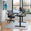 Electric Standing Desk 60x30 black in lowered position at home