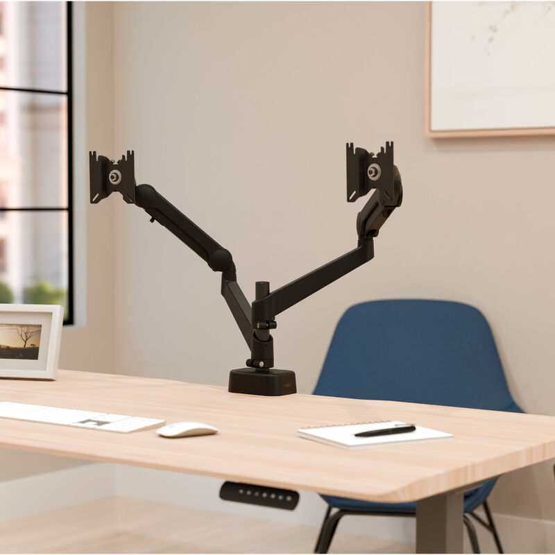 front of the desk view of the dual monitor arms installed on a desk with no monitors attached image number null