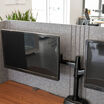 close up of monitors setup on a desk with the tall privacy desk surround setup