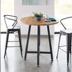 Standing Round Table Butcher Block shown with two chairs in office