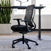 side view of performance task chair in office setting