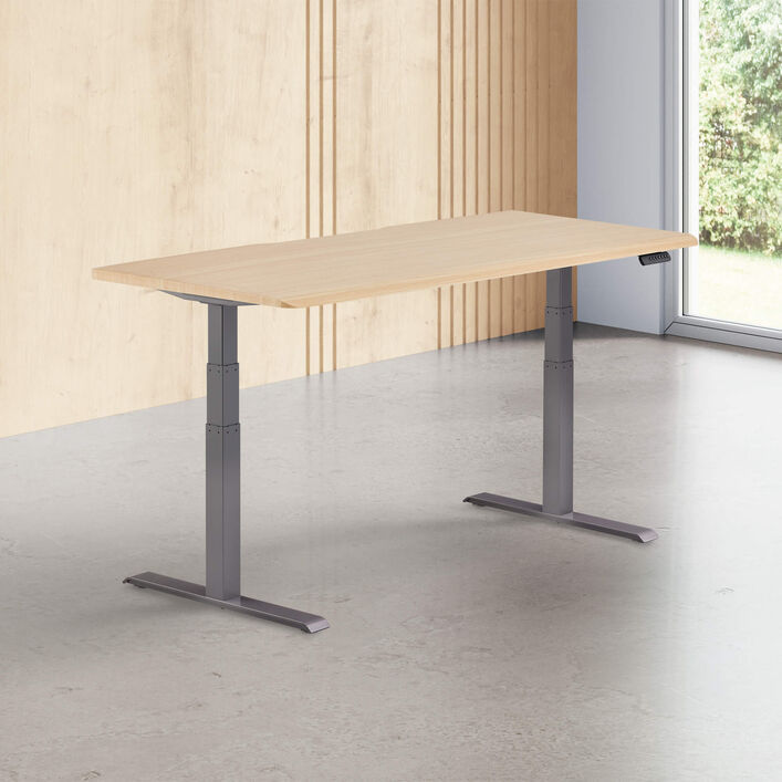 light wood finish standing desk top with slate legs in a open office image number 0