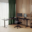 lowered l shape desk in black in an at home office setting 