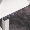 closeup view of essential electric standing desk in white finish