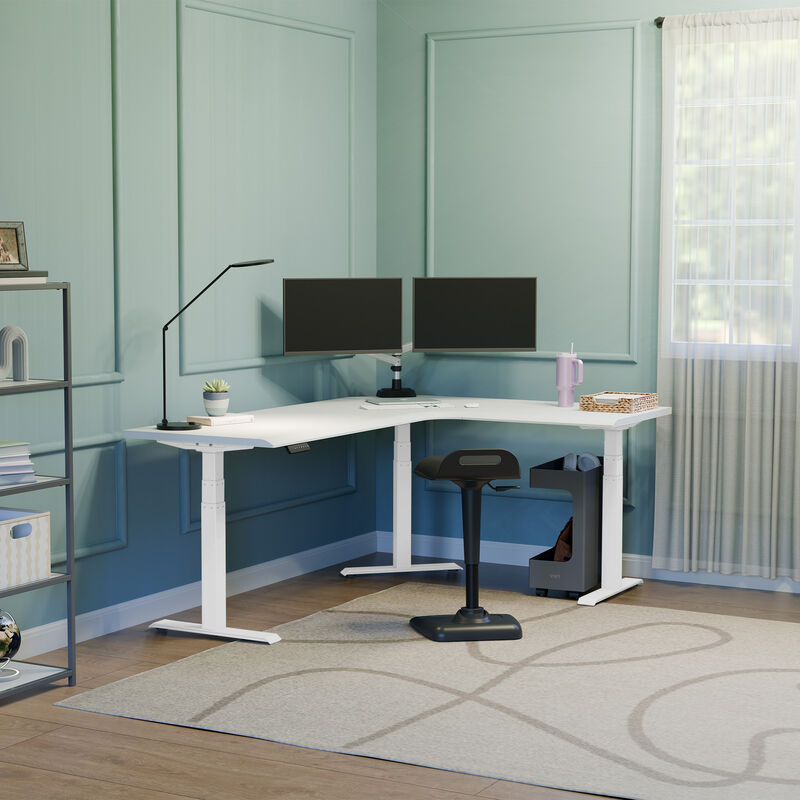 l shape electric standing desk with a white desktop and white legs in a lowered positon  image number null