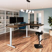 l shape electric standing desk in a raised position
