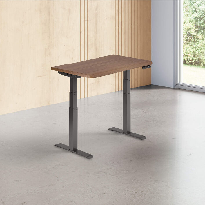 walnut finish standing desk top with slate legs in a open office image number 0