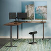 raised l shape desk in walnut in an at home office setting 