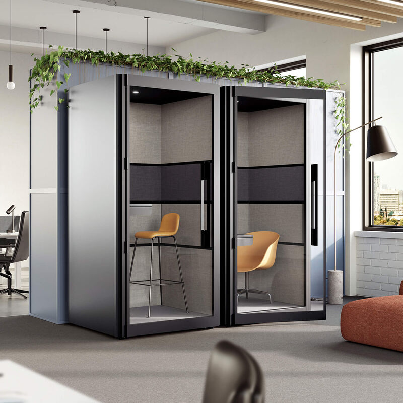 one person privacy booth in the black finish against a wall in an office space angled view image number null