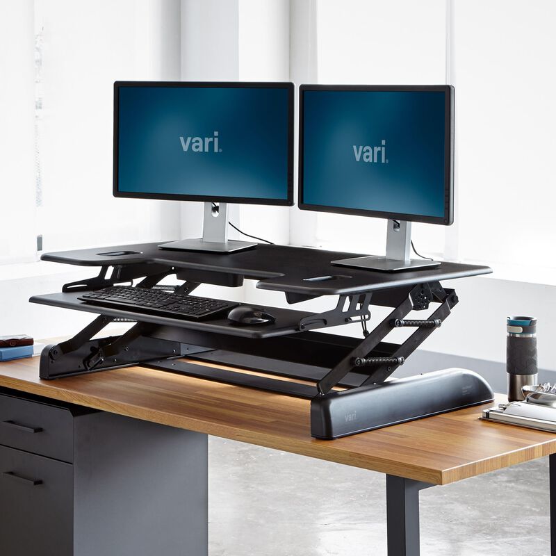 VariDesk® Tall 40 Black in raised position at office image number null