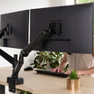 showing the backside of two monitors using the dual arm monitor