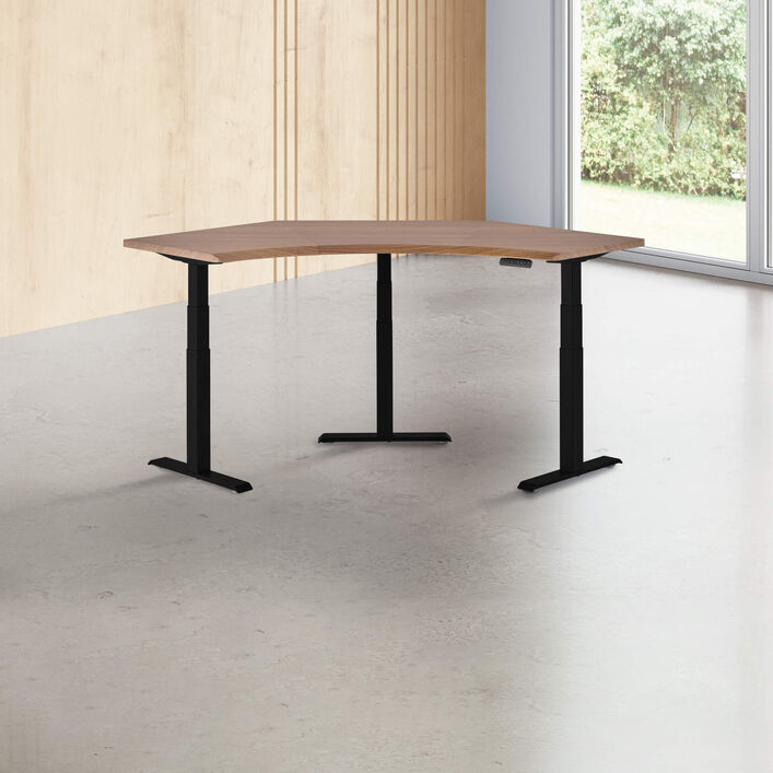 walnut finish standing desk top with black finish legs in a open office image number 0