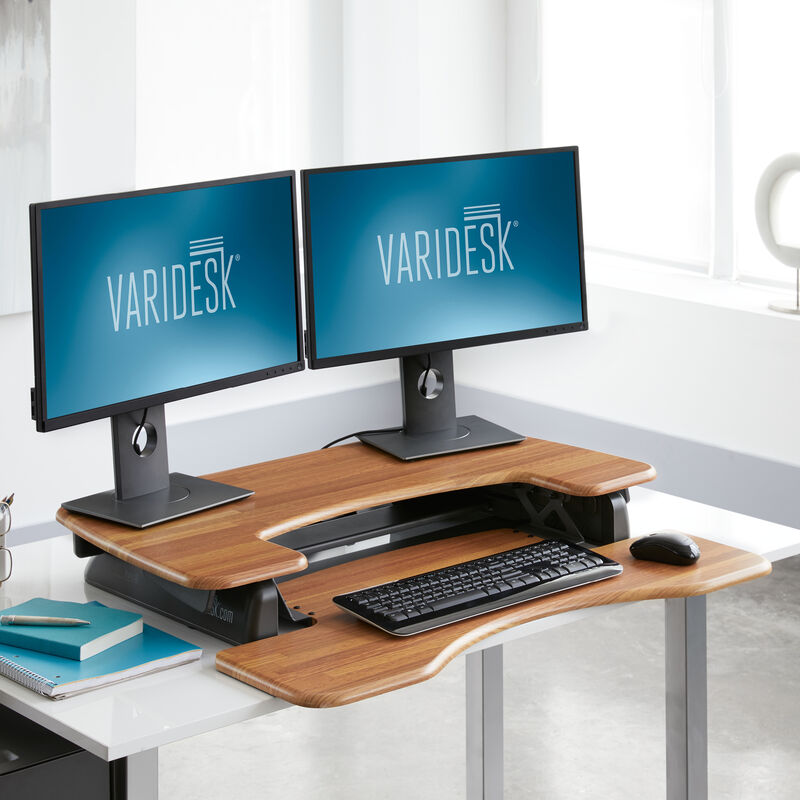 VariDesk Pro Plus 36 Butcher Block sit-stand desk converter lowered in office  image number null