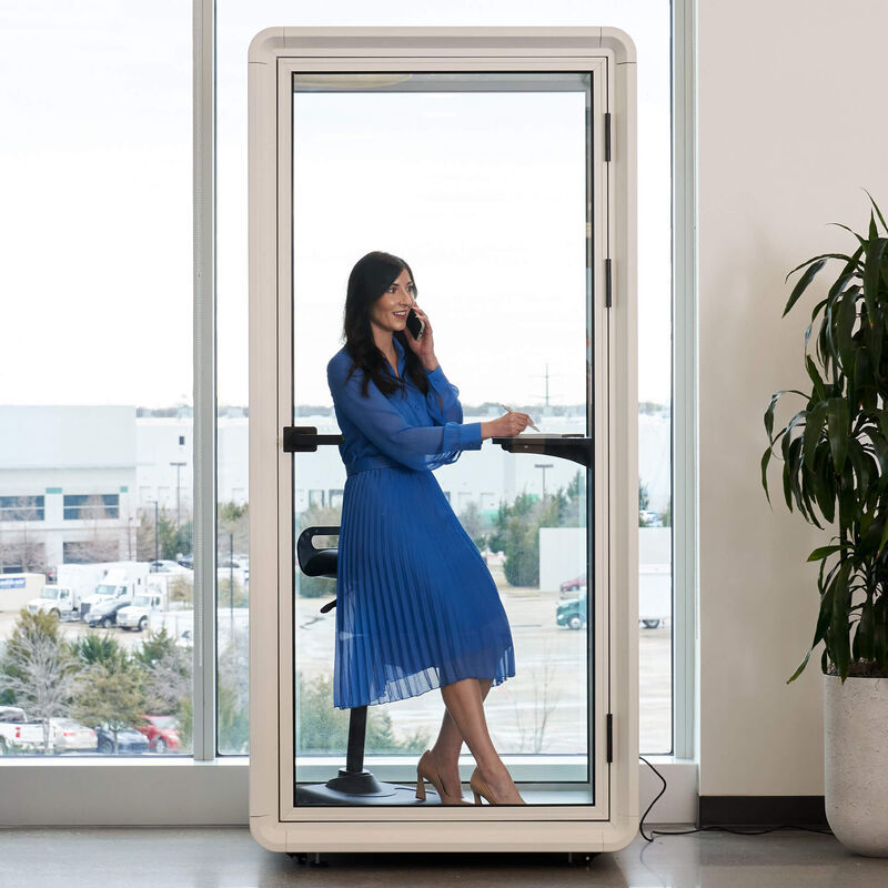 privacy booth in use with a person making a call with the door closed image number null