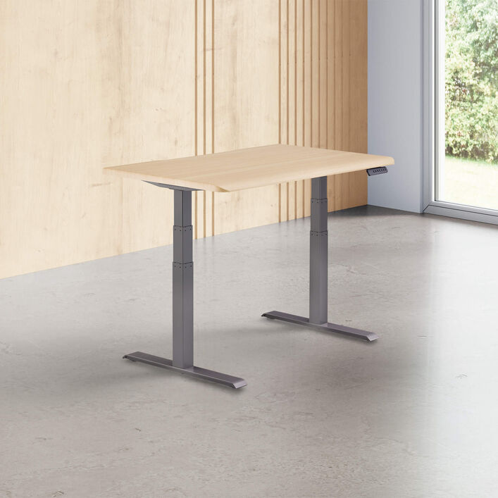 light wood finish standing desk top with slate legs in a open office image number 0