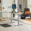 Electric Standing Desk 48x30 White in lowered position at home