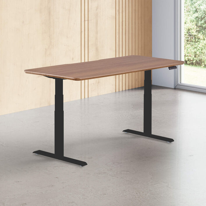 walnut finish standing desk top with black legs in a open office image number 0