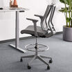 drafting chair in grey in office setting