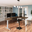 l shape electric standing desk in a lowered position