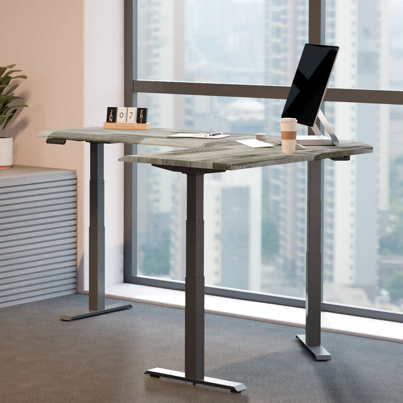 driftwood electric standing desktop with slate legs in an office setting in a raised position image number null