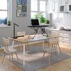 VariDesk Laptop 30 desktop converter raised on dining room table in a home office