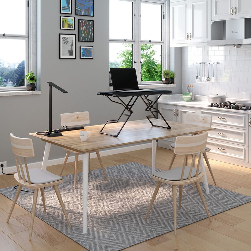 VariDesk Laptop 30 desktop converter raised on dining room table in a home office image number null