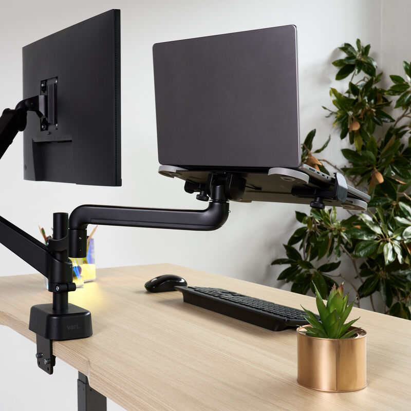 back view of a laptop sitting on top of the laptop holder installed on a desk image number null