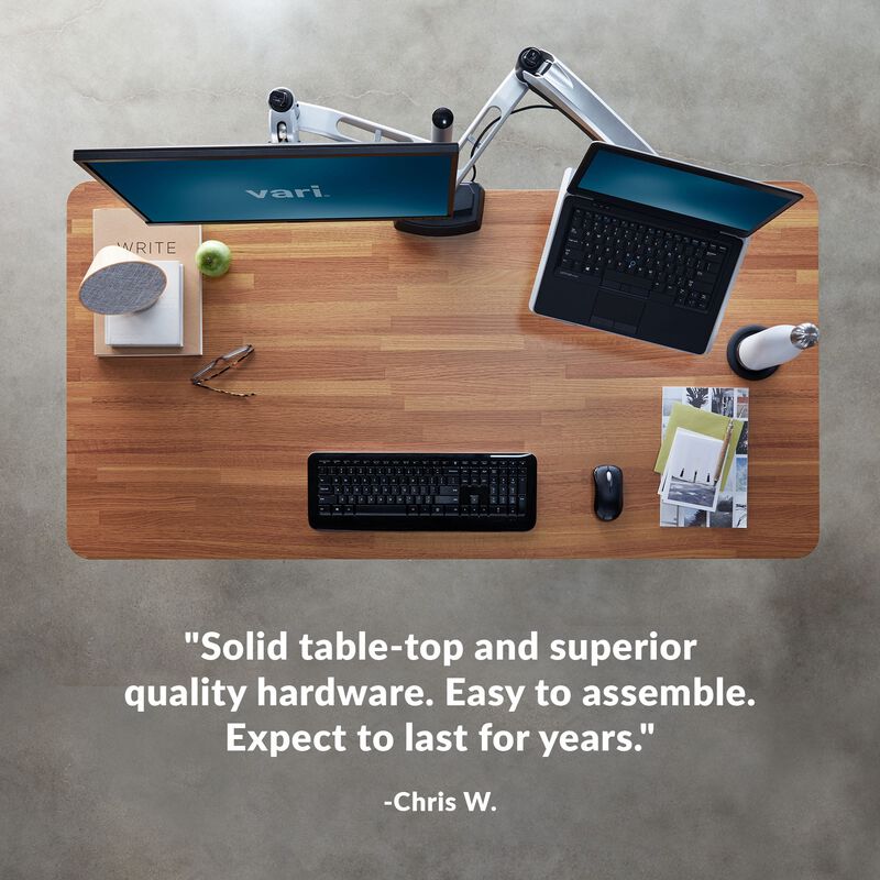 Overhead view of standing desk with a quote at the bottom of the image saying "Solid table-top and superior quality hardware. Easy to assemble. Expect to last for years." image number null