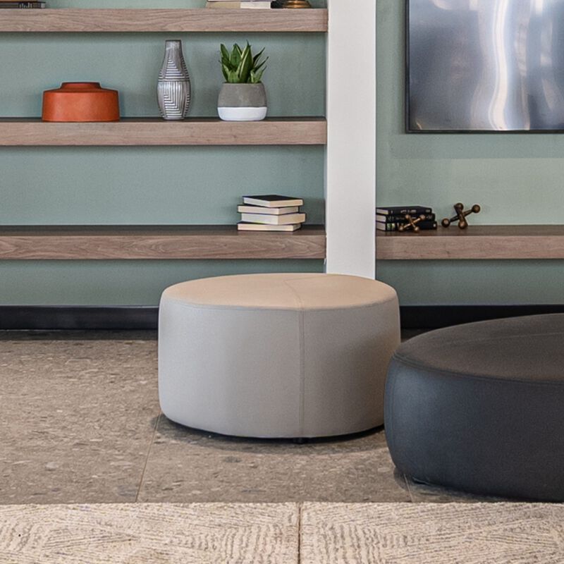 small sand grey ottoman in lounge setting  image number null