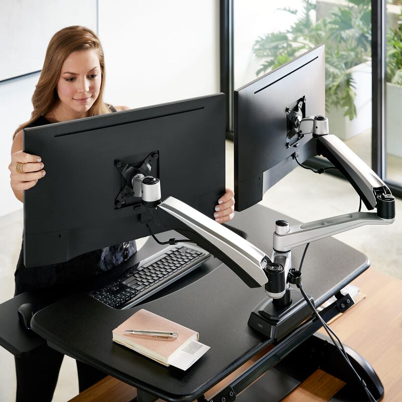 professional adjusting dual-monitor arm attached to a varidesk converter image number null