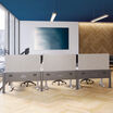 three beam privacy panels installed on beams in an office setting 