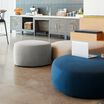 small light grey ottoman in lounge setting