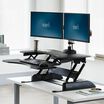 varidesk pro plus 36 black sit-stand desk converter in raised position in office