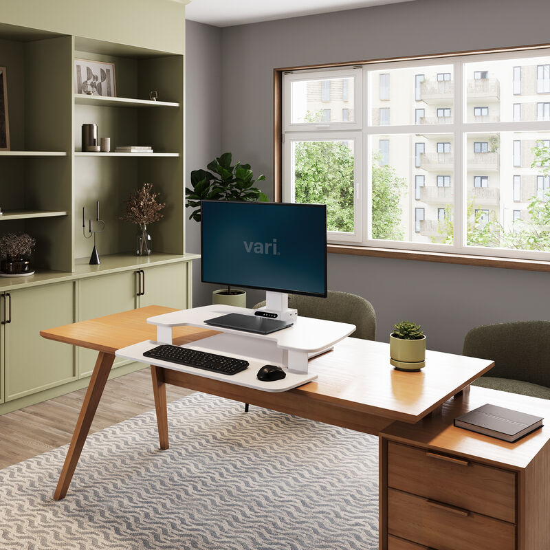 varidesk electric single monitor converter in white in a lowered position on desk  image number null